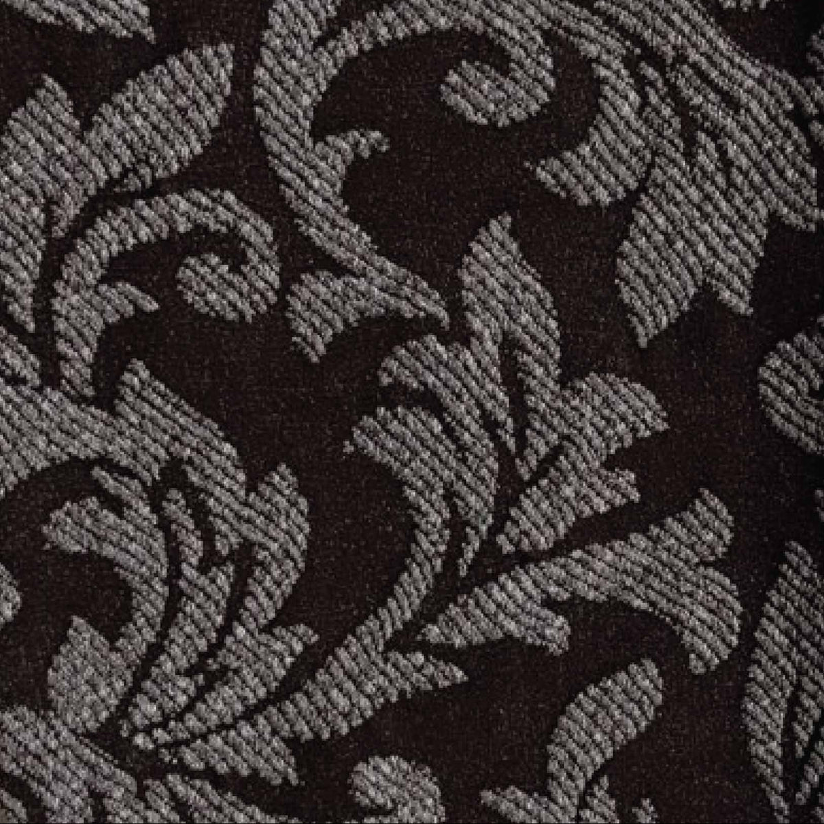 A close-up of a dark brown and light brow damask patterned tights