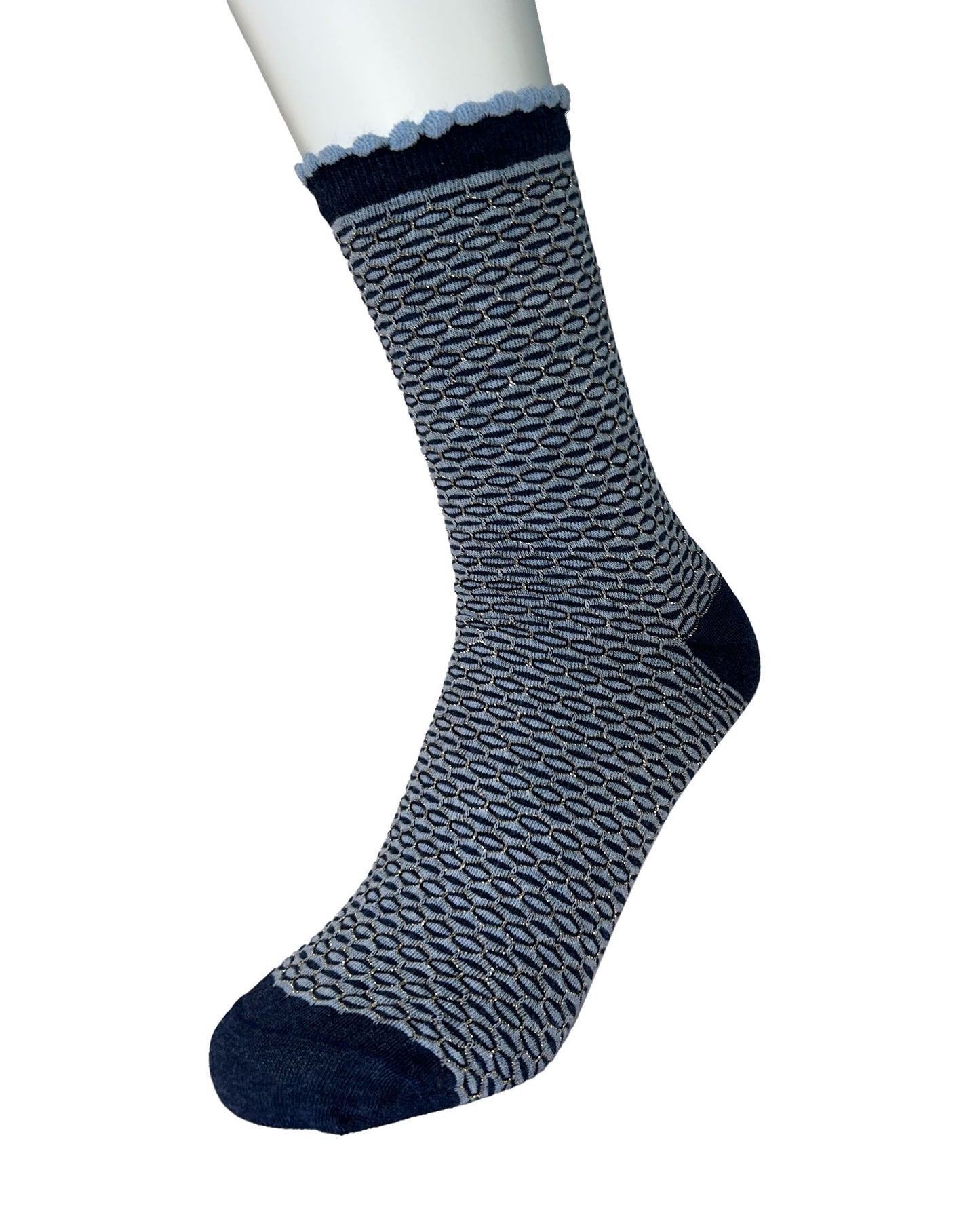 Blue and navy patterned sock on a white mannequin foot with a white background